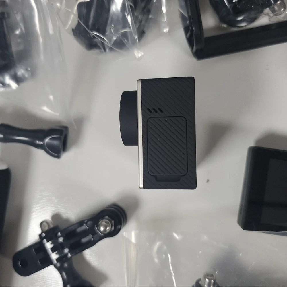 GoPro Hero4, Two Batteries, And Accessories Lot. Mounts, Body And Head Harness
